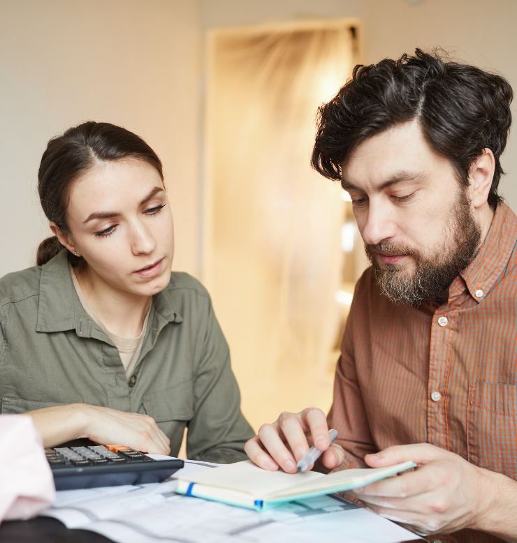 Couple calculating costs